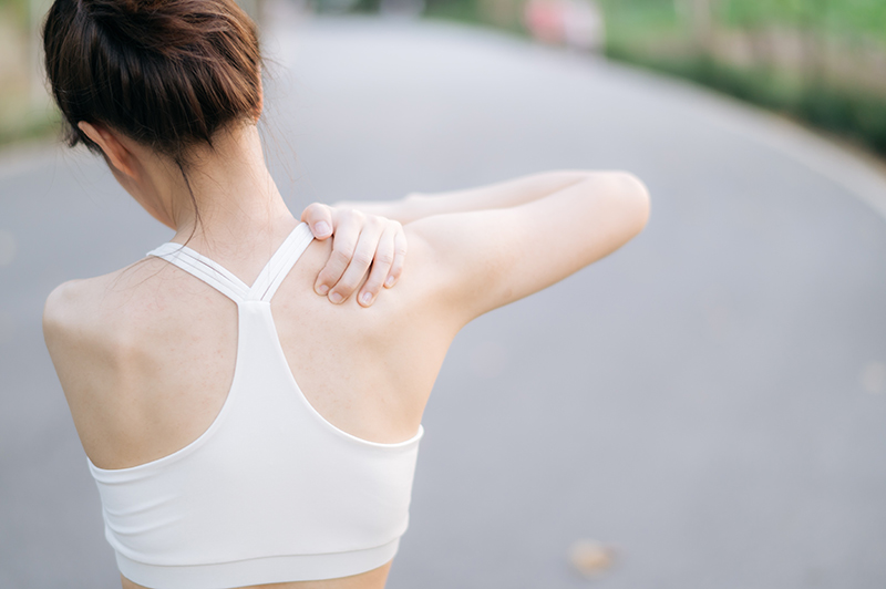 Woman experiencing difficulty with movement during exercise due to a SLAP tear